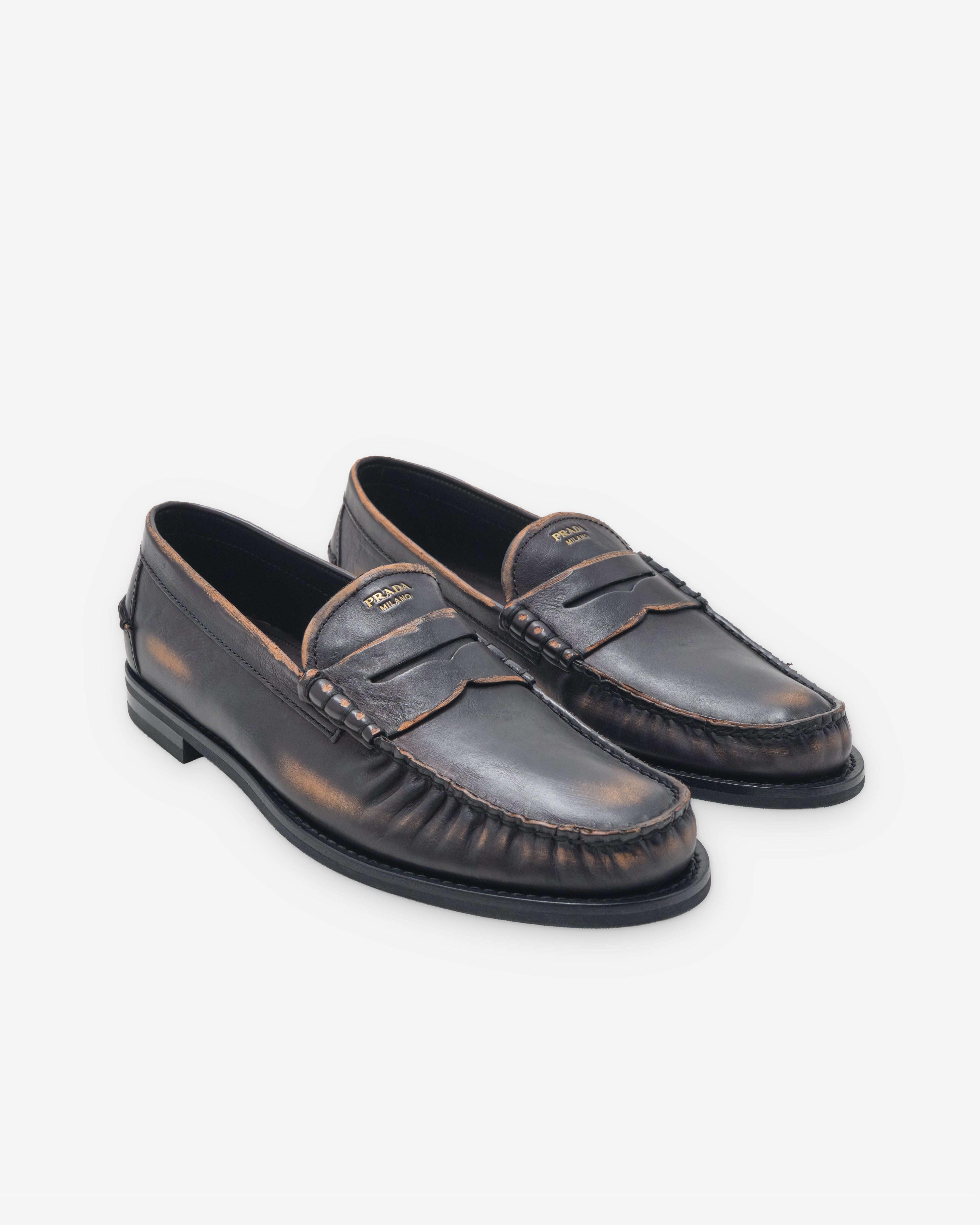 Prada: Men's Antiqued Leather Loafers (Black/Tan) | DSMNY E-SHOP