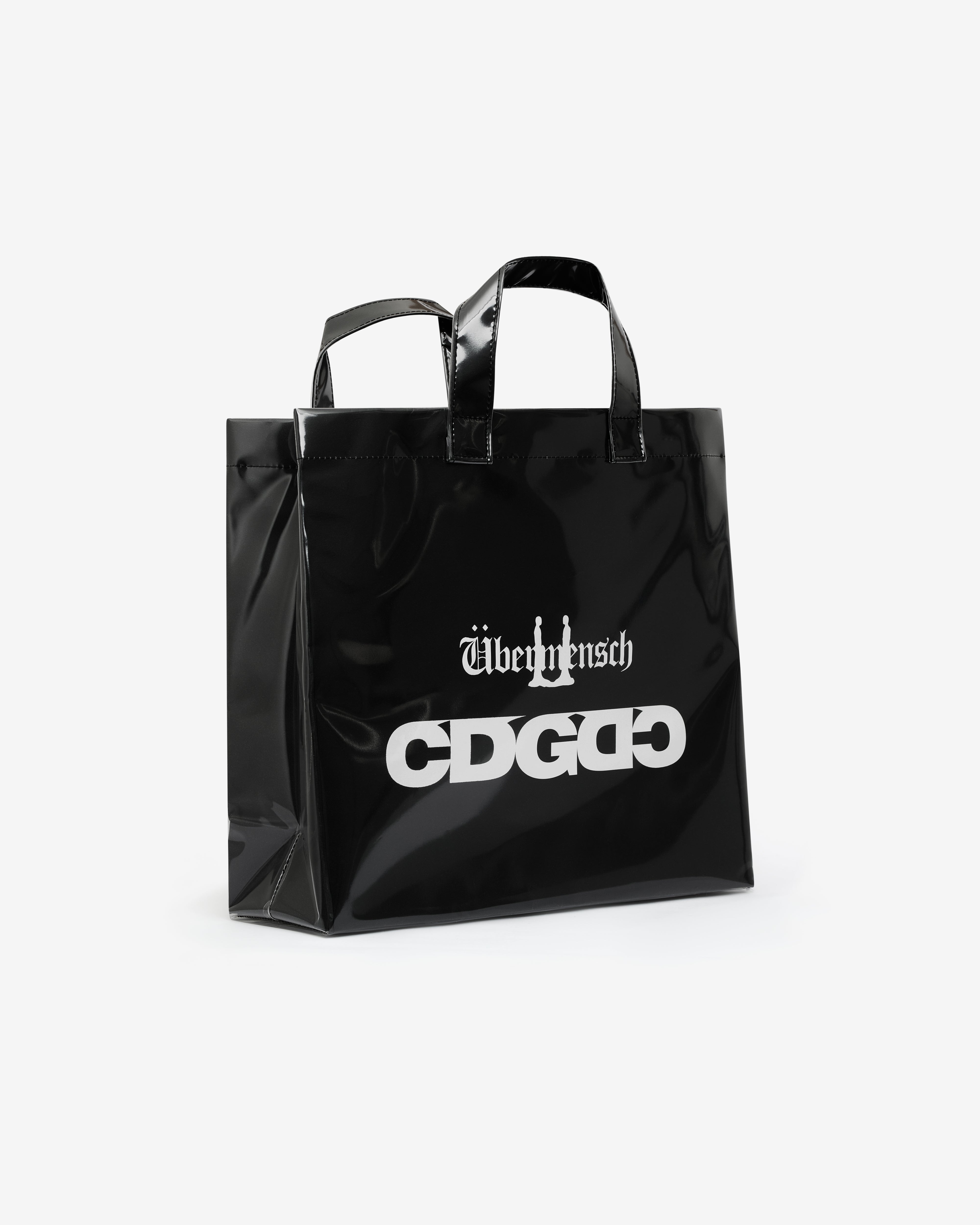 CDG: G-DRAGON Übermensch PVC Tote Bag (Black) | DSMNY E-SHOP