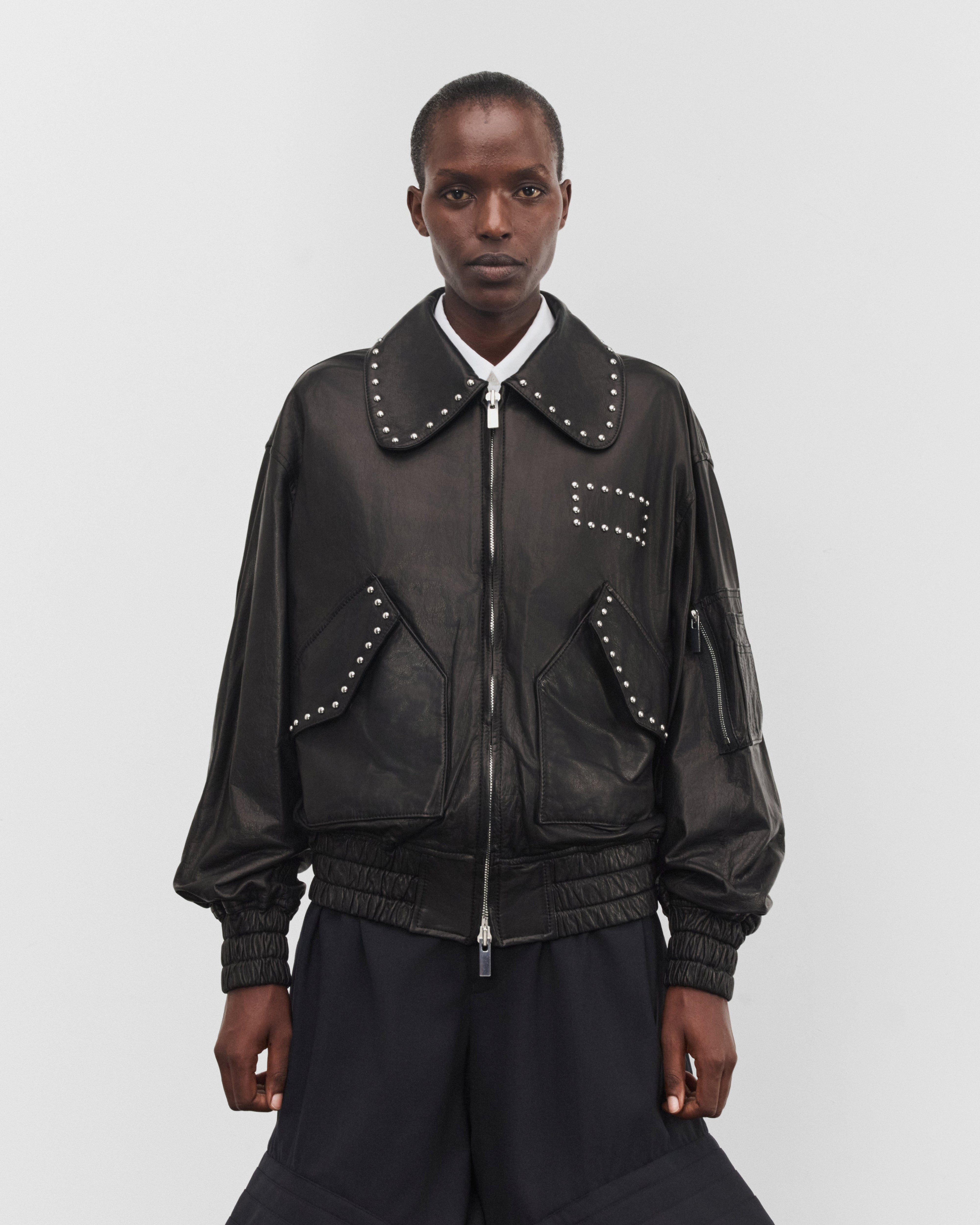 Noir Kei Ninomiya: Women's Studded Leather Jacket (Black) | DSMNY